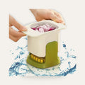 Fruit and veggie cup slicer in use on a plain studio background