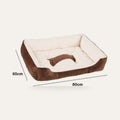 Large warm plush dog and cat bed on a plain studio background