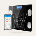 Bluetooth smart body fat scale with phone app on a plain studio background